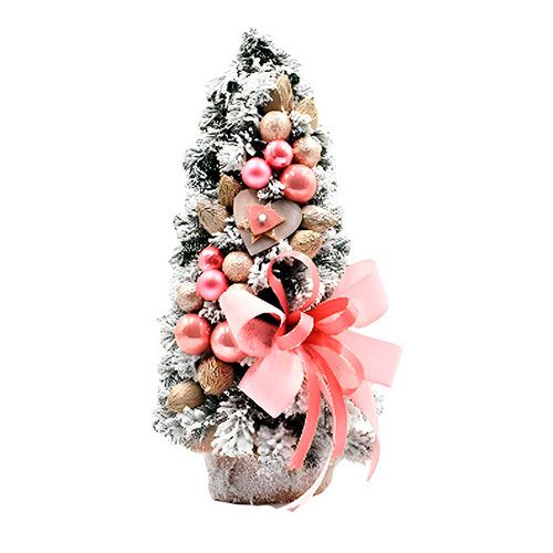 Декоративная искусственная елка с розовыми шарами и заснежанными ветками
